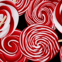 Peppermint Twist - Tossed Peppermint Lollipops on Black