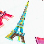 Tossed Colorful Eiffel Towers on Ivory