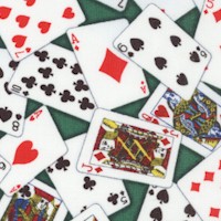 Tossed Small-Scale Playing Cards on Green